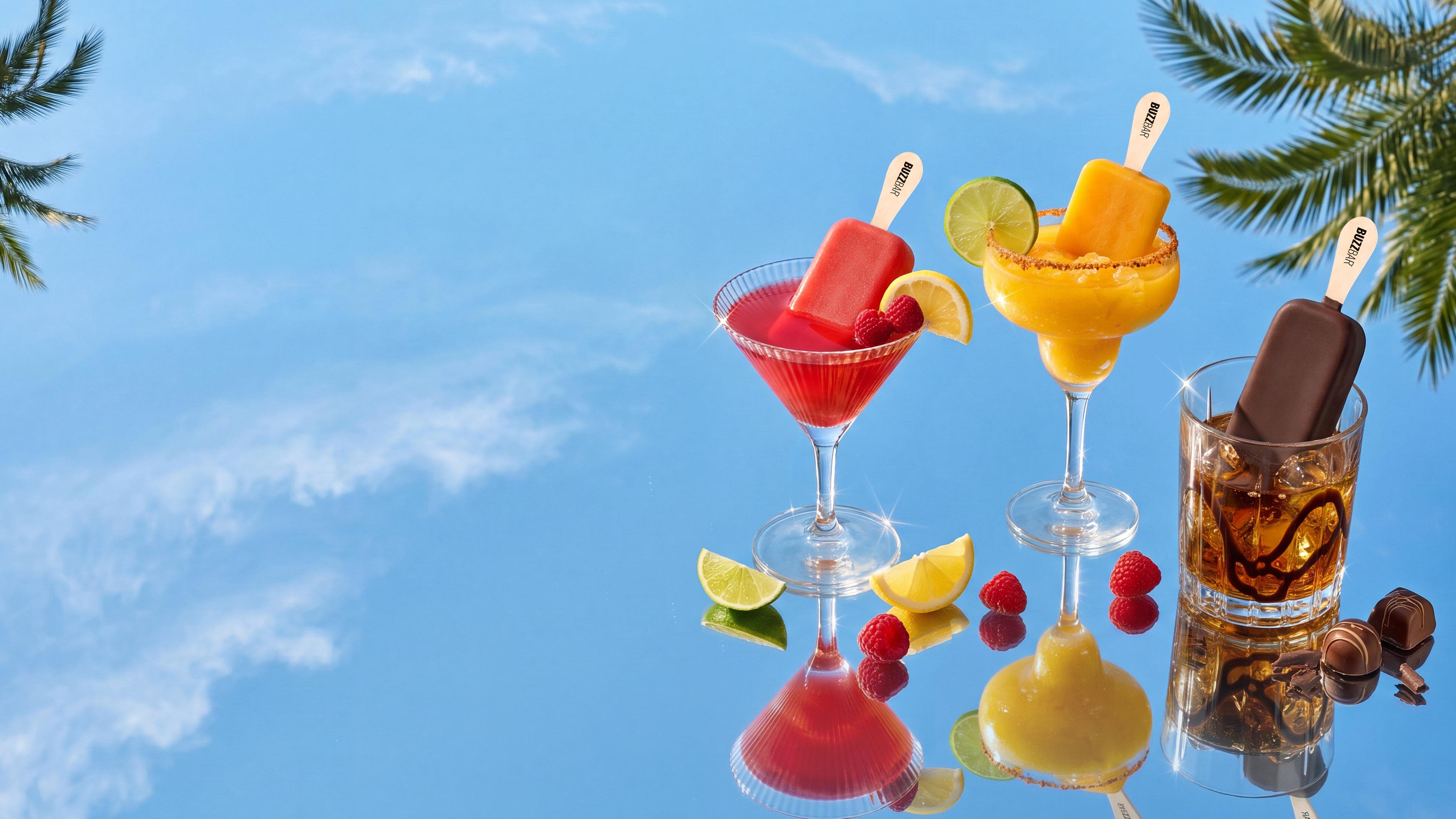 BuzzBar ice cream bars served in cocktail glasses against a burgundy velvet curtain